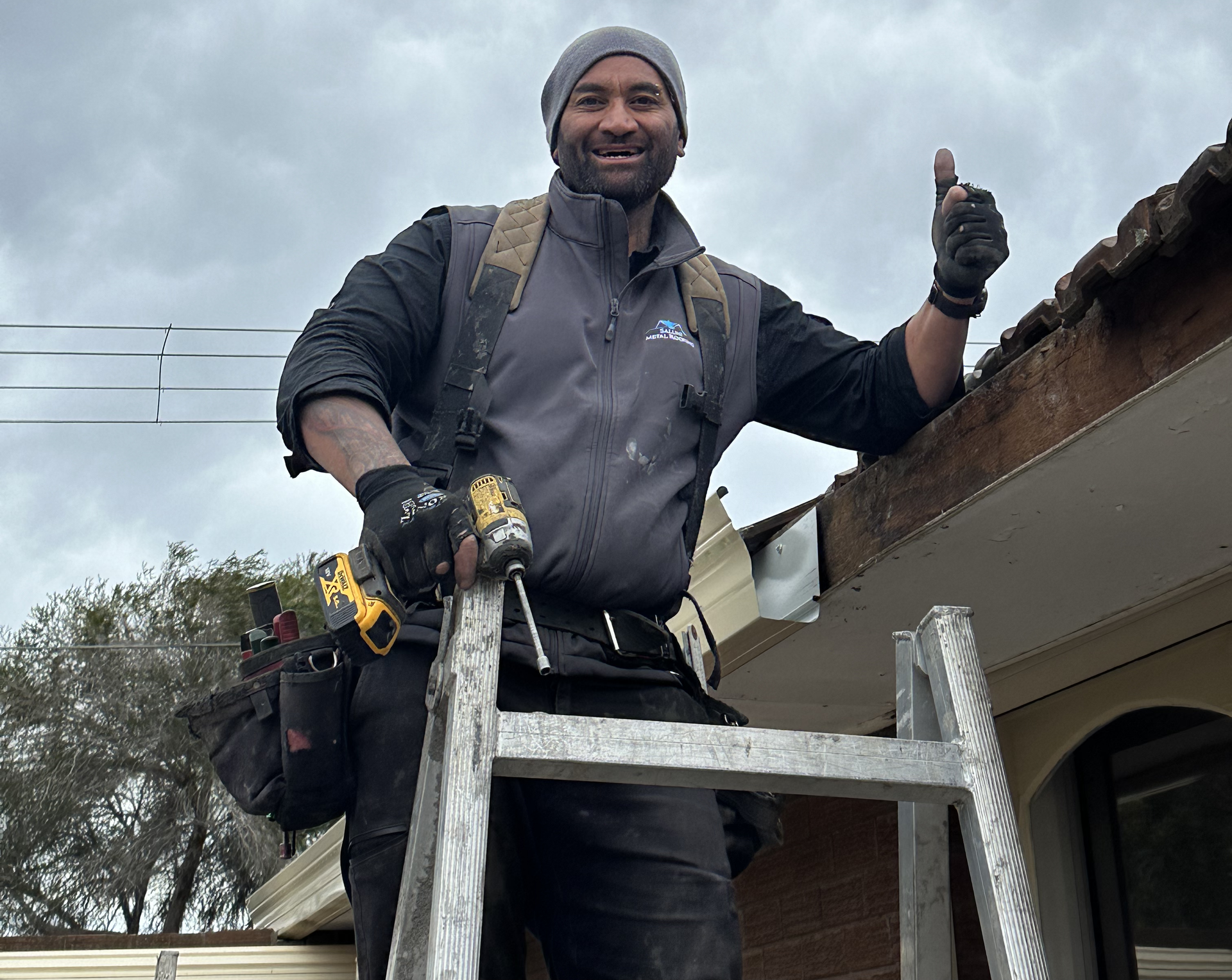 Hutch Saluni on the roof — thumbs up